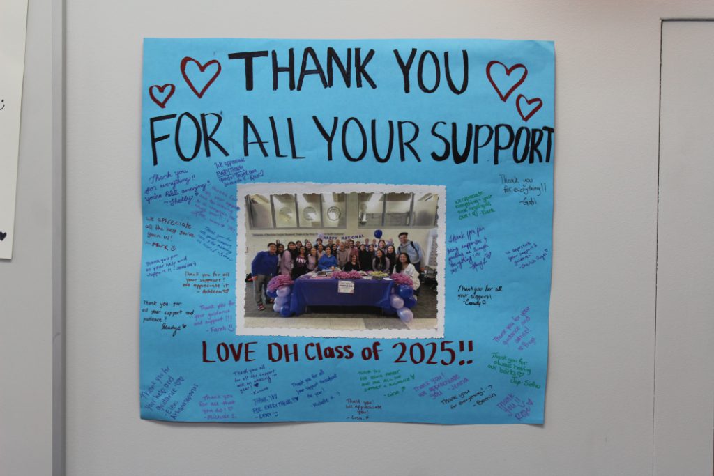 Main text reads: "Thank you for all your support. Love DH Class of 2025!!" Photo of class at centre of poster. Drawings of four hearts. The students signed names and included messages.