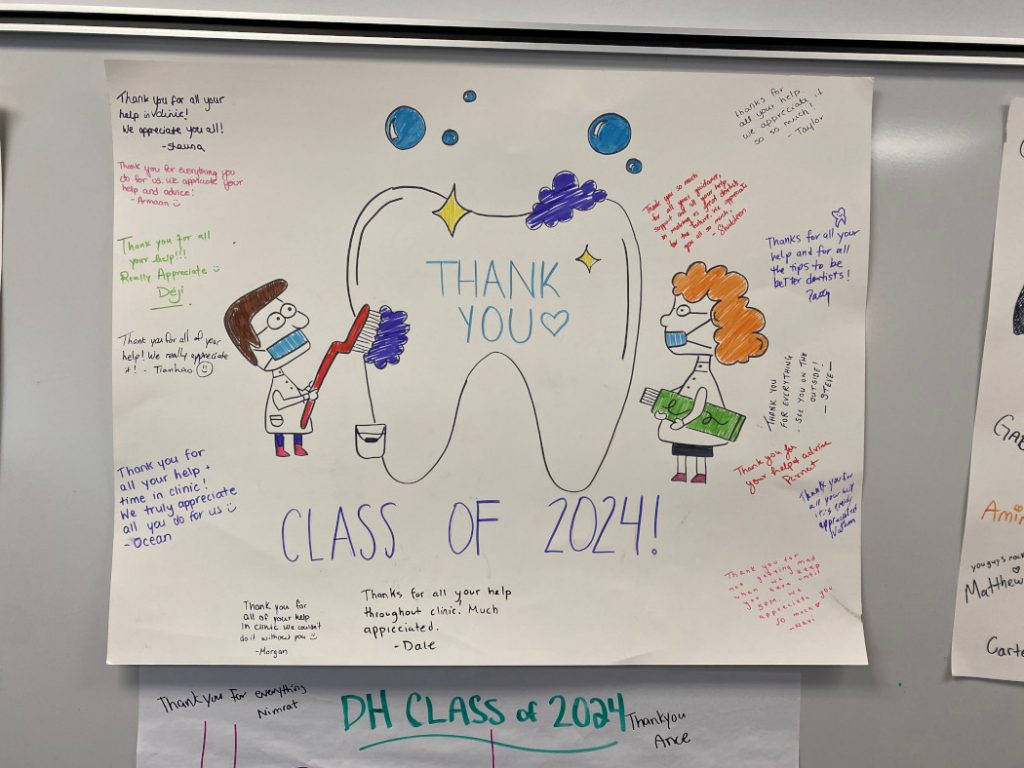 Poster main text reads: "Thank you. Class of 2024!" Drawing of dental care professional brushing a giant tooth and another dental care profession holding a large tube of tooth paste. The students signed names and included messages.