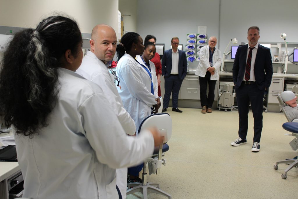 A student speaks with Health Minister Mark Holland. 