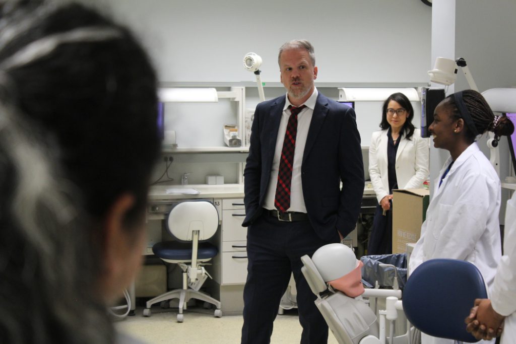 Health Minister Mark Holland speaks with students. 