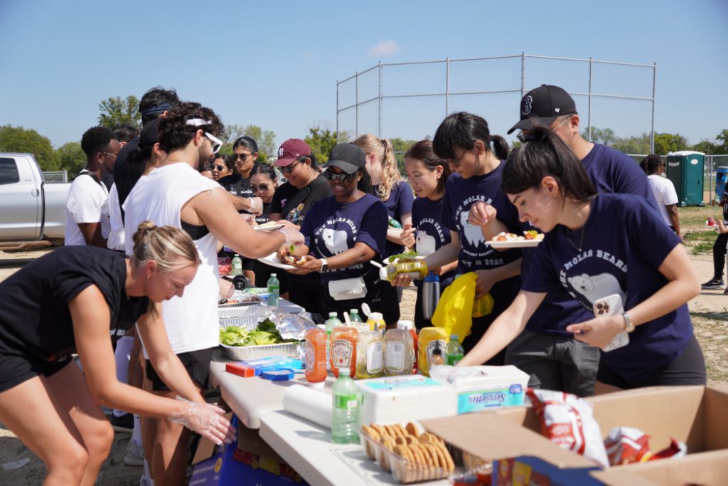 People line up for food. 