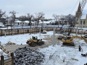 Four construction vehicles on the constructions site. 