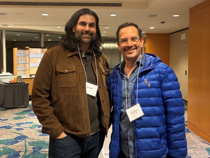 Two people pose for a photo. 