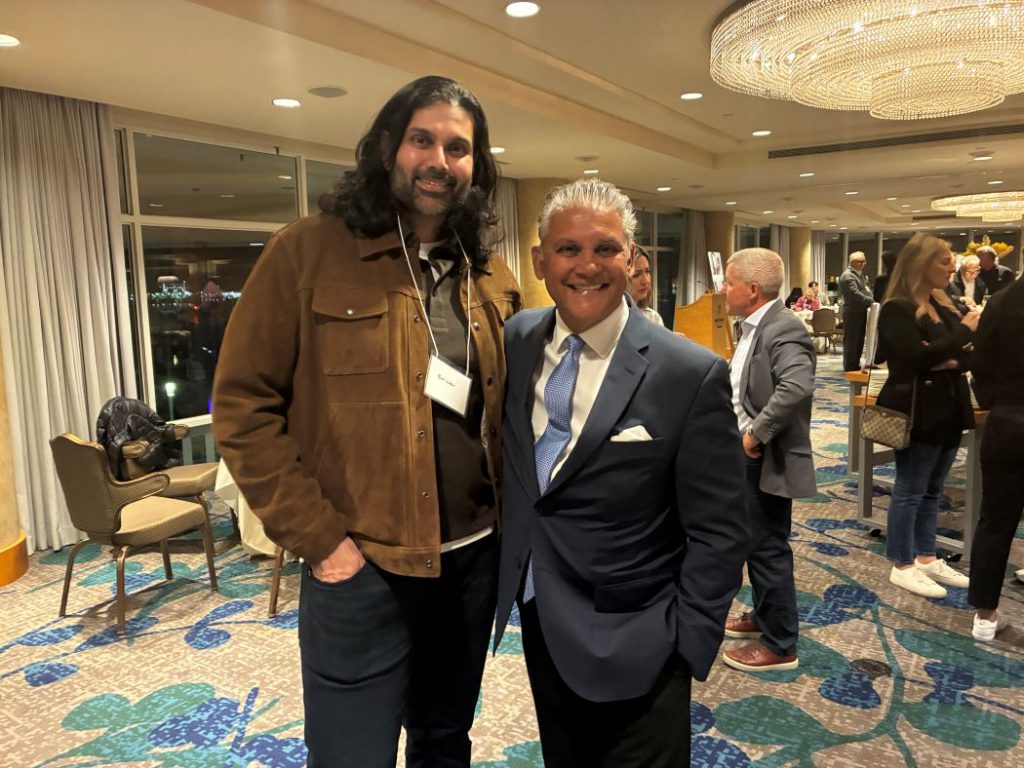 Two people pose for a photo. 