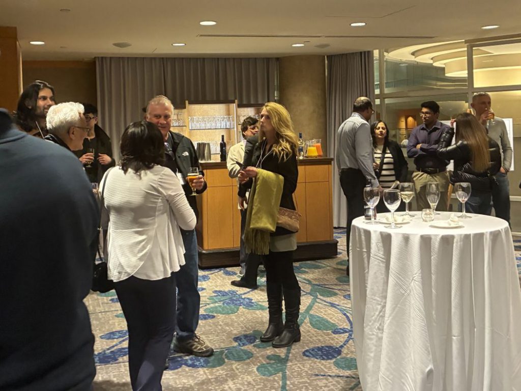 Groups of people talk. 