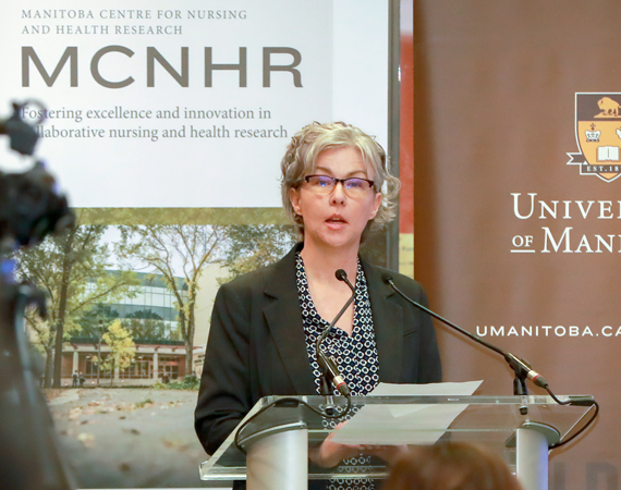 Dr. Kellie Thiessen speaks at a funding announcement at the College of Nursing in 2019.