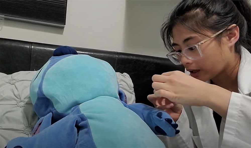 Nursing student Mikaela Canda demonstrates skills on a stuffed animal.