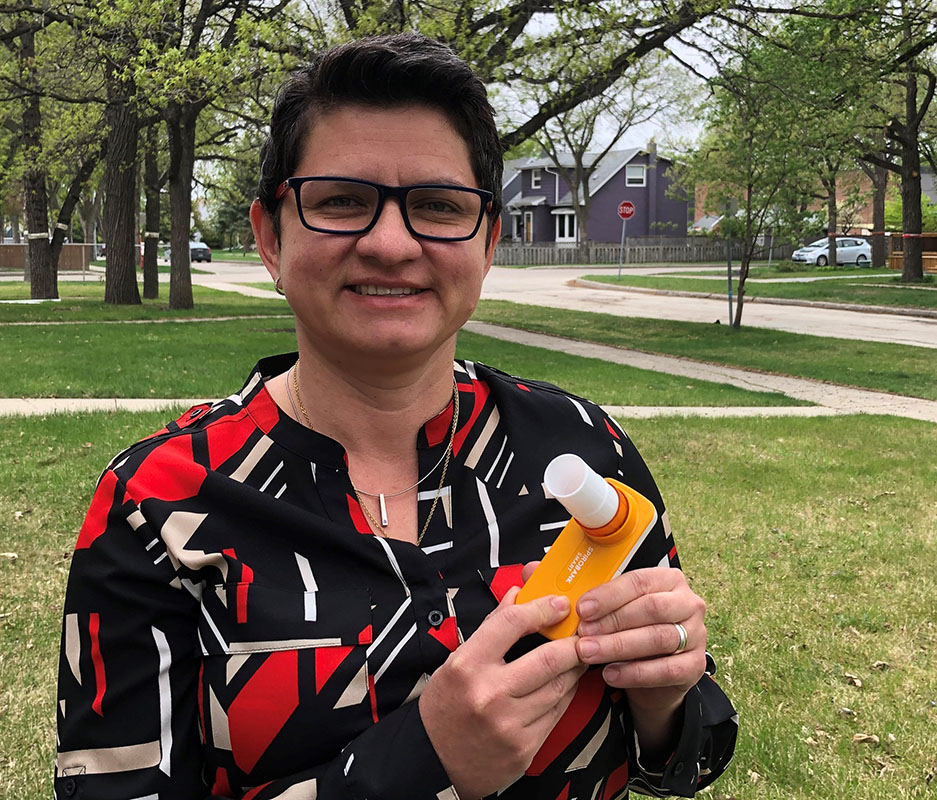 Dr. Diana Sanchez-Ramirez with a portable spirometer.