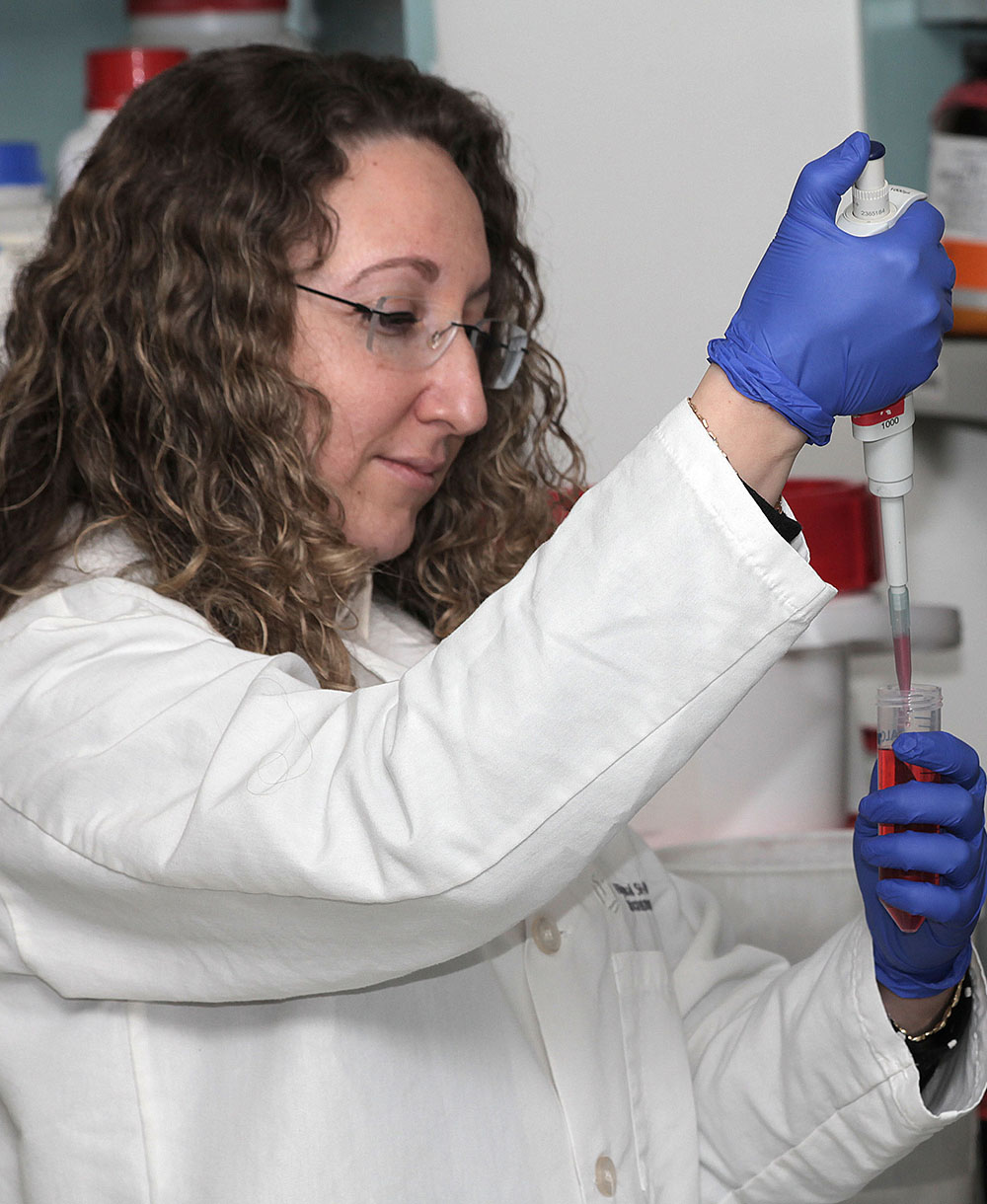 A researcher works in a lab.