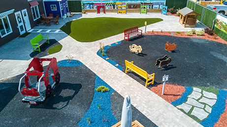 A children's play park designed for road safety with child-sized roads and amenities.