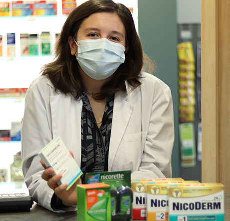 Pharmacy student Christine Vaccaro with products eligible for subsidy.