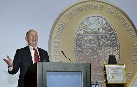 Ernest Rady stands at a podium.