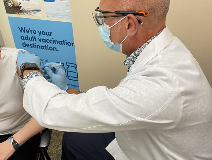 Pharmacist Hans Epp administers a Covid vaccine.