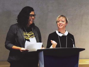 Dr. Marcia Anderson (left) and Dr. Jillian Waruk (right) at a podium.