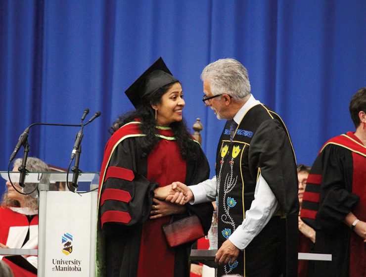 UM President and Vice-Chancellor Dr. Michael Benarroch congratulates Dr. Preetha Krishnan on receiving her PhD.