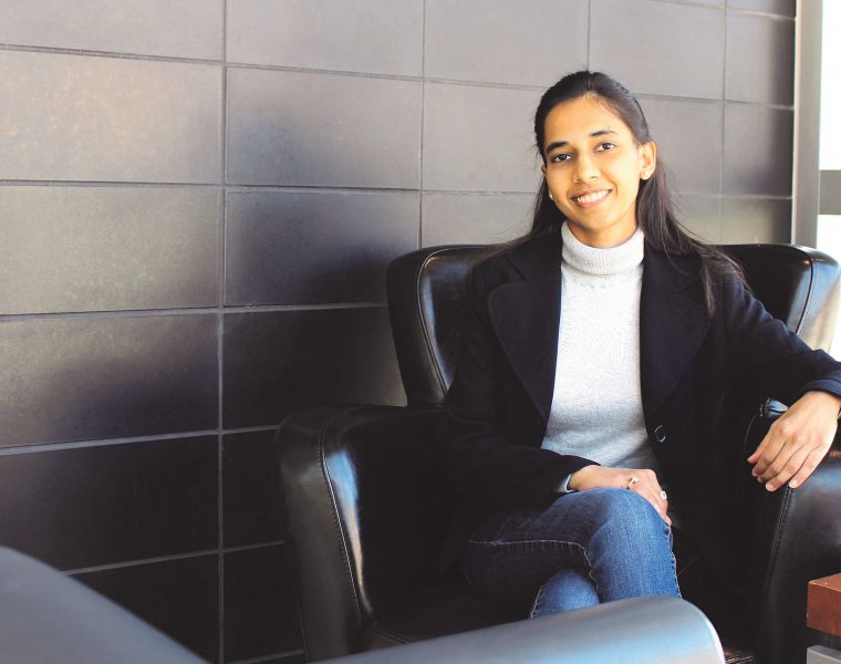 Shweta Mital sitting in an armchair.