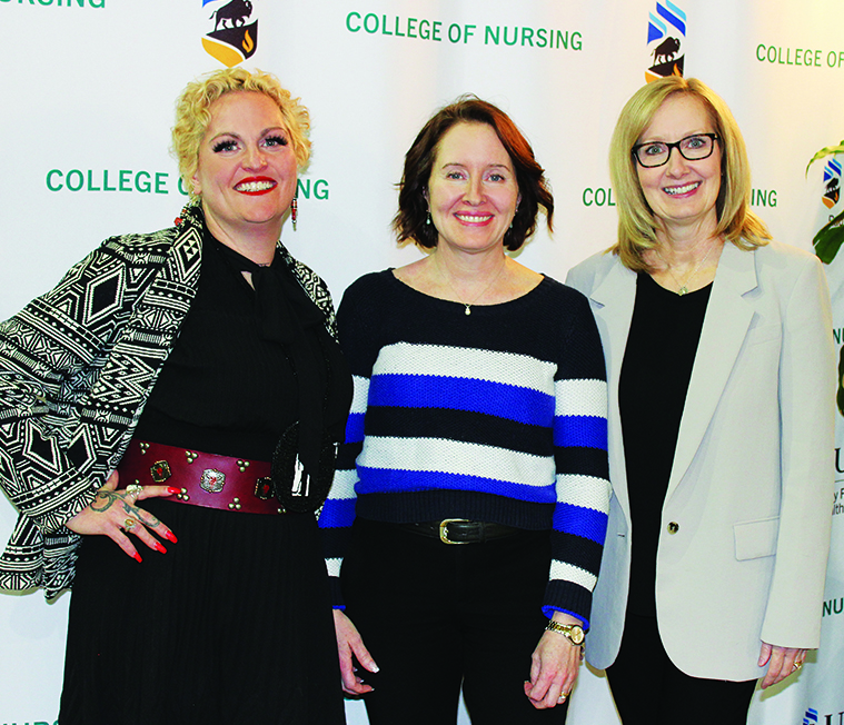 Stephanie Van Haute, Cindy Fehr and Lisa Merrill stand in front of a College of Nursing banner.