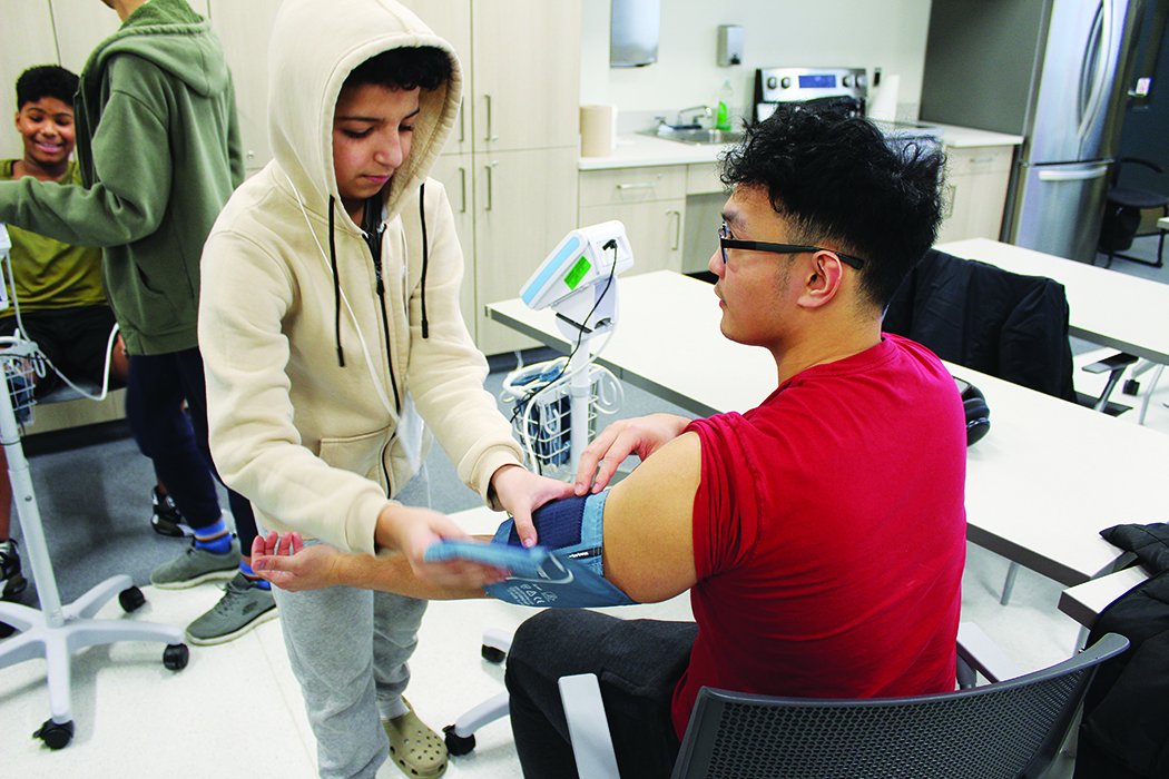 CanU participants learn to take vital signs at the College of Rehabilitation Sciences.