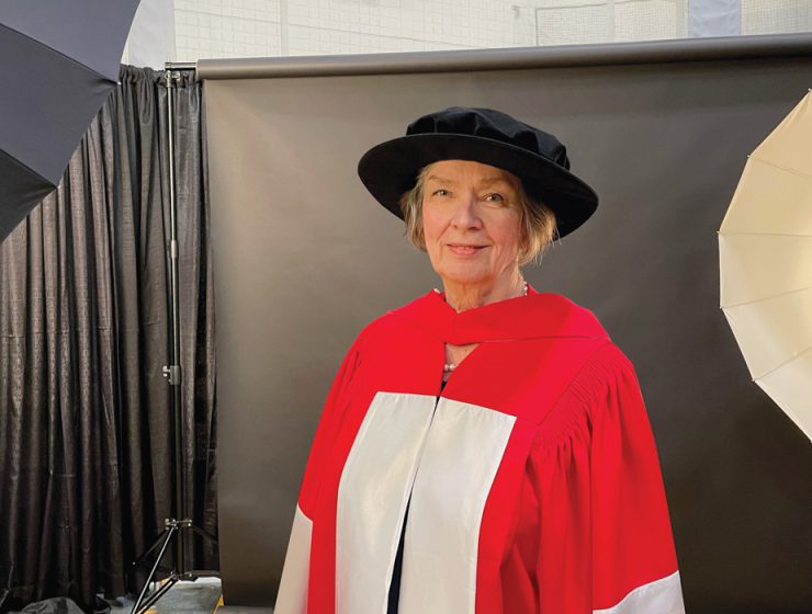 Jan Currie poses in her ceremonial attire before receiving her honorary doctorate at UM Convocation.