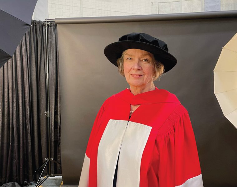 Jan Currie poses in her ceremonial attire before receiving her honorary doctorate at UM Convocation.
