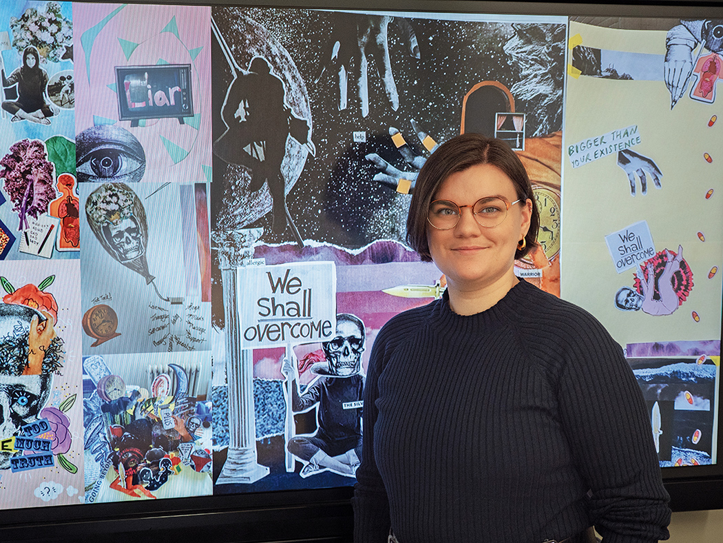 Jen Sebring stands with artworks created by research participants.