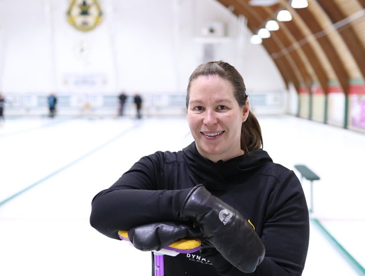 Lisa Bartley poses in a curling rink.