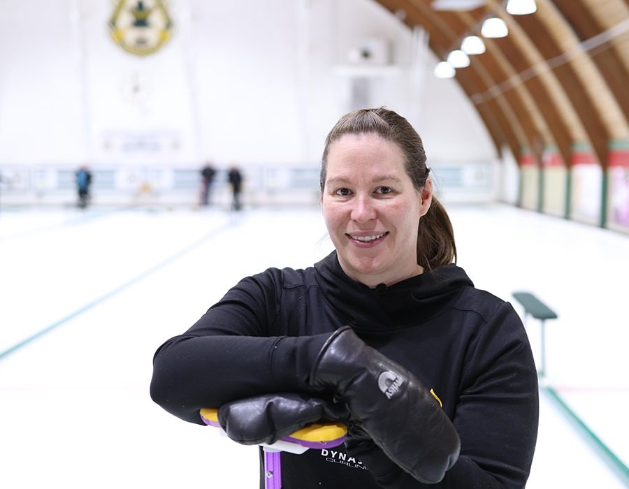 Lisa Bartley poses in a curling rink.