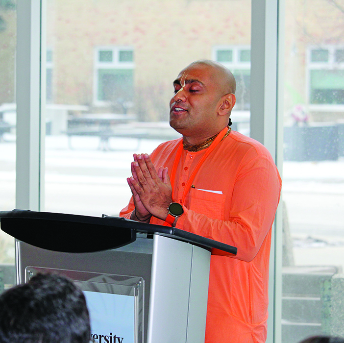 Hindu leader Sanatana Dharma Das prays at the dedication ceremony for the Multi-faith Centre.
