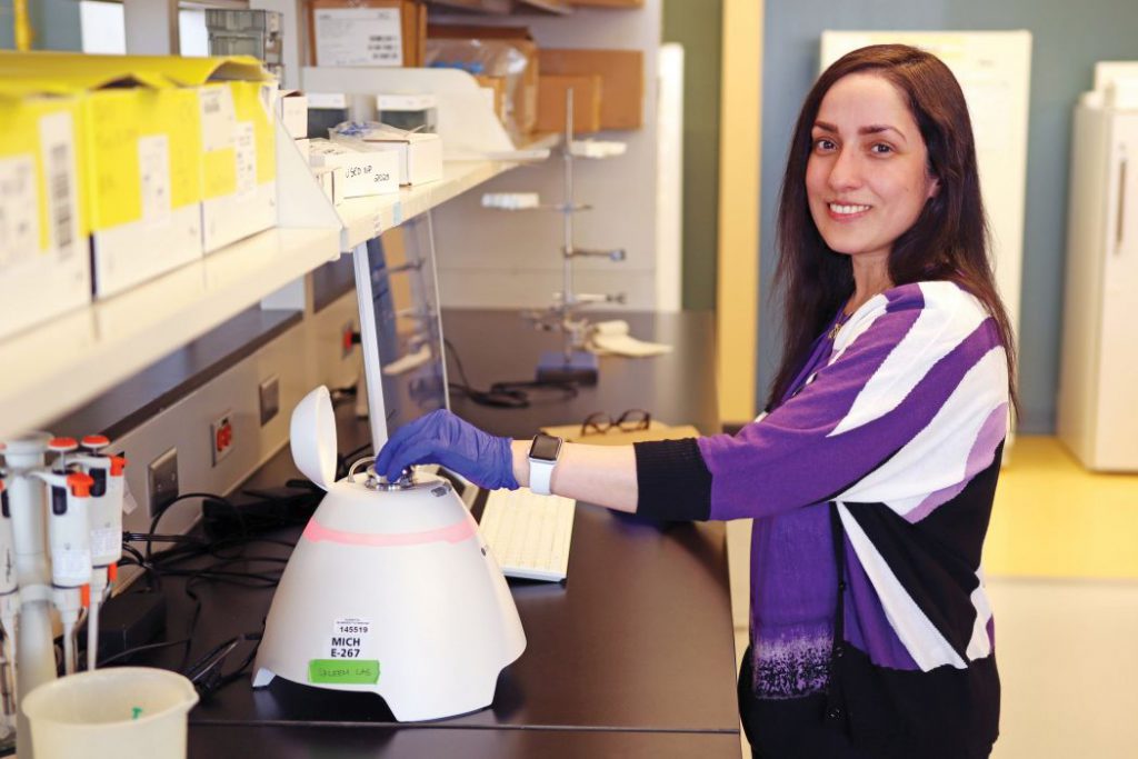 Dr. Ayesha Saleem with a machine called the Exoid.
